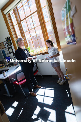Robert Russell, director of the Center for Academic Success and Transition, chats with Kyanne Casper