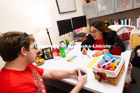 Mari Beck talks with Jacob Behnk, a senior studying Spanish and global studies, in her office in the