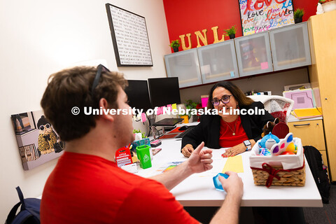 Mari Beck talks with Jacob Behnk, a senior studying Spanish and global studies, in her office in the