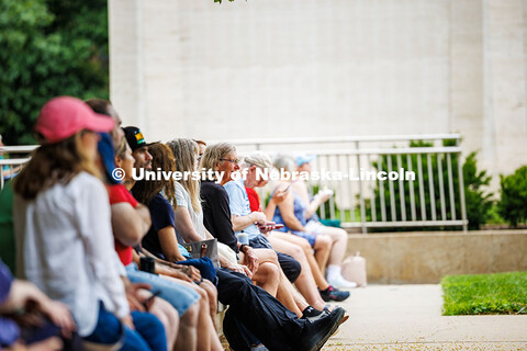 A group of spectators listen along during Sam Greenfield’s performance for the final session of Ja