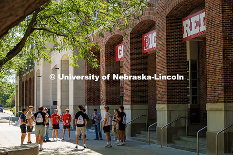 A group of NSE students stand in a circle outside the City Campus Union to play an icebreaker game i