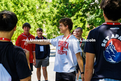 Will Callahan, of Shawnee Kansas, points to a group member during an ice breaker game in-between ses