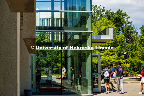 NSE groups walk into Adele Coryell Hall Learning Commons for their next session called “Husker Pow