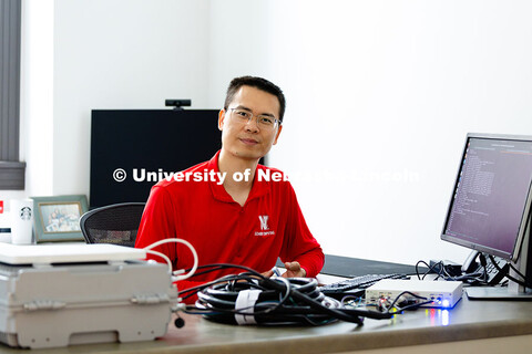 Qiang Liu, assistant professor in the School of Computing, is pictured in his office in Avery Hall. 