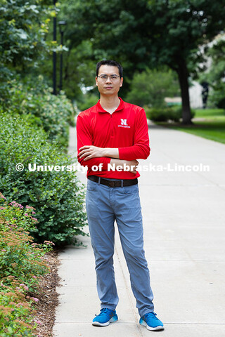 Qiang Liu, assistant professor in the School of Computing stands outside for a portrait. June 26, 20