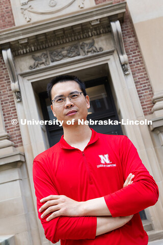 Qiang Liu, assistant professor in the School of Computing, stands in front of Avery Hall. June 26, 2