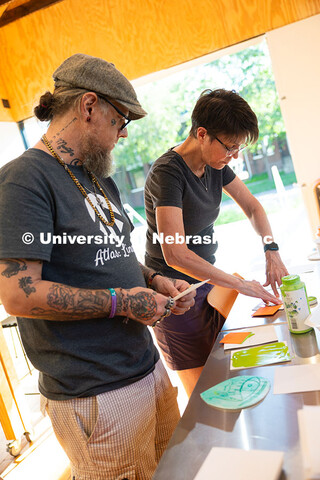 Jean Stryker, creative arts director for F Street Neighborhood Church, presses a paint-covered stamp