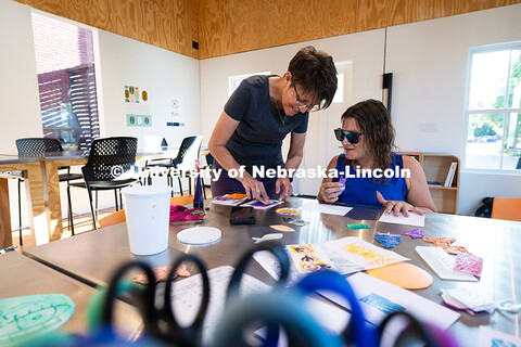 Jean Stryker (left), creative arts director for F Street Neighborhood Church, shows Jessica Hernande