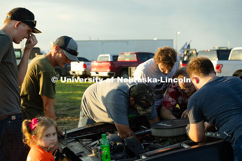 Members of the UNL Figure 8 Racing Team troubleshoot in the parking lot south of the Polk County Fai