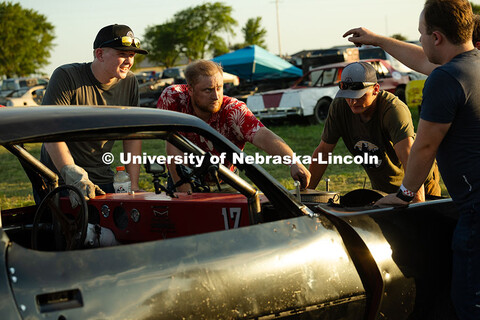 Members of the UNL Figure 8 Racing Team troubleshoot in the parking lot south of the Polk County Fai