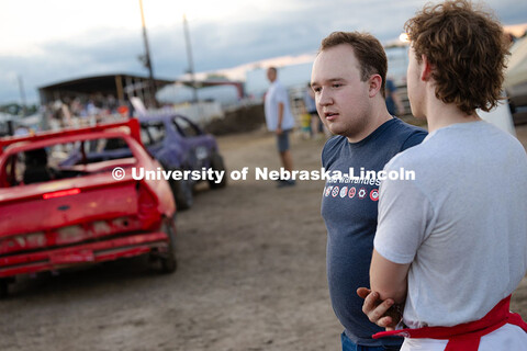 Brothers Grant (left) and Ian Gouldie watch as cars line up before the Figure 8 Racing finals at the