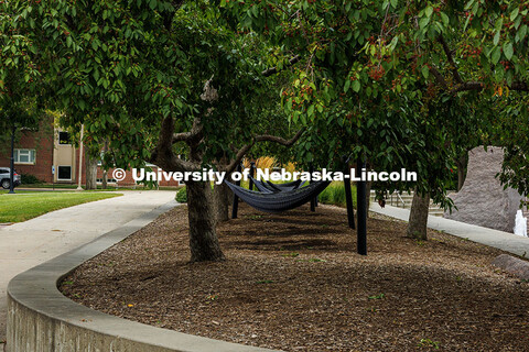 Hammocks sit empty by the Nebraska Union plaza. Summer on City Campus. July 16, 2025. 