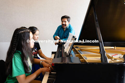 Marcelo Lian works with high school students on a piece by Frederic Chopin during the 2025 Lied Cent