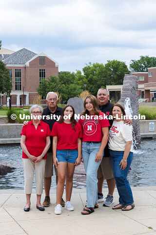 Sisters Madison and Lauren Haring pose with their family in front of Broyhill Fountain. The Haring f