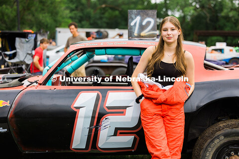 Anna Hadan, senior mechanical engineering student at UNL, poses next to the UNL Figure 8 car before 