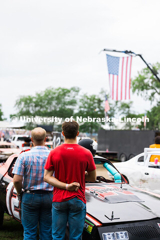 Jace Grunden (left) and Ayden Shook (right) face the American flag while the national anthem played 