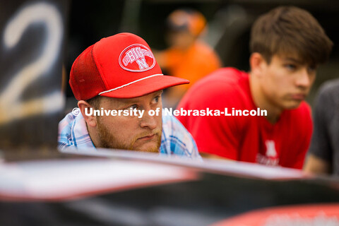 Jace Grunden, agricultural engineering major looks at team members as they try to get the race car w