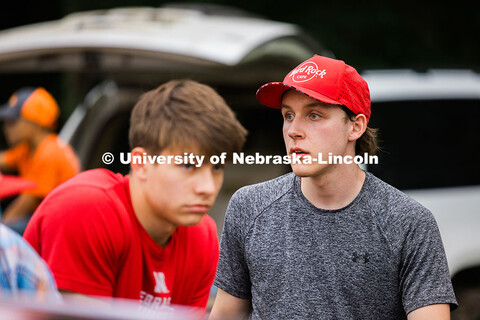 Ian Gouldie, UNL robotics engineering student, works on the figure 8 race car between races at the S