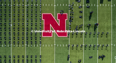 Chairs are set up on Tom Osborne Field in Memorial Stadium for Saturday’s commencement. May 6, 202