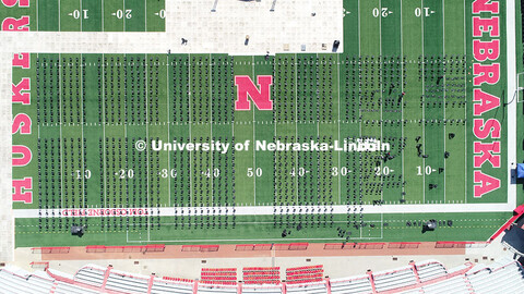 Chairs are set up on Tom Osborne Field in Memorial Stadium for Saturday’s commencement. May 6, 202