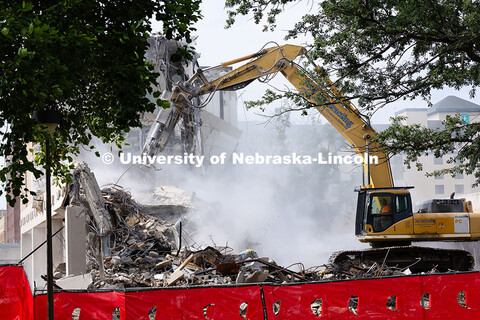 A concrete pulverizer attachment is used on an excavator to break apart the former Westbrook Music B