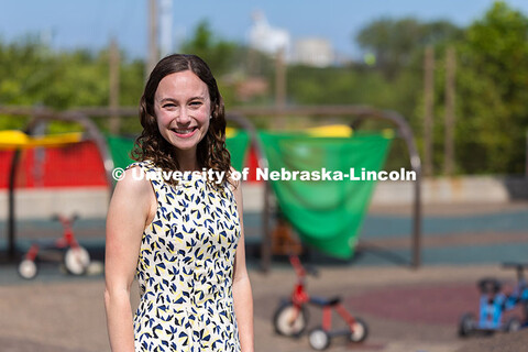Portrait of Jenna Finch, Assistant Professor of Psychology, is pictured at the playground of the UNL