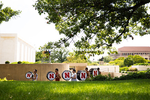 The Cornhusker Marching Band percussionists practice in the shade during Marching Band camp. August 