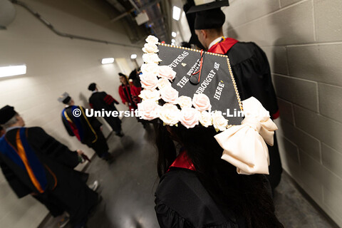 Yahaira Vazquez decorated her cap with roses and the words "Pupusas and the people brought me here."