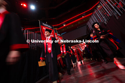Graduates enter Pinnacle Bank Arena at the start of the summer commencement ceremony. Summer Commenc