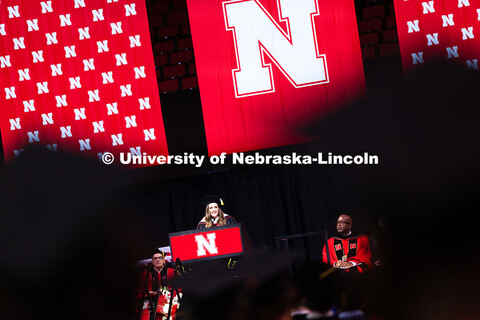 Libby Wilkins, Student Regent and President of the Association of Students, speaks to graduates duri