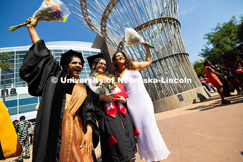 Anuradha Choudhary, Kashish Verma and Ana Clara Gomez pose together outside of Pinnacle Bank Arena. 