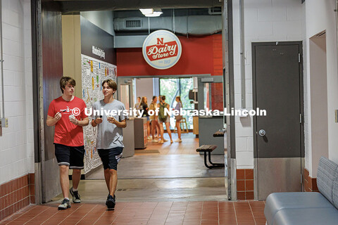 Rush Chipman and Dylan Cooper (left to right) chat as they leave the Dairy Store with ice cream duri