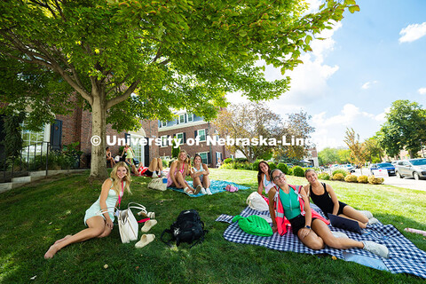 Students lounge on the lawn outside of Kappa Alpha Theta in between sorority recruitment events. Aug