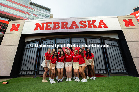 Student Orientation Leaders pose for a photo in Memorial Stadium just before the Tunnel Walk begins.