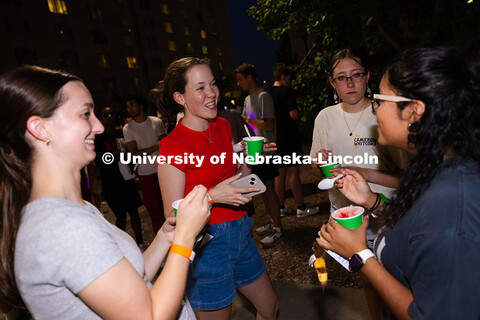 Katie Lewison, in red, Callista Pittman (left), Elizabeth Schramm and Stephanie Umanzor (right) chat