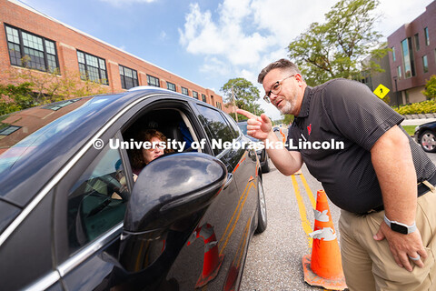 Josh Overocker, Associate Vice Chancellor for Student Life, directs a family toward the Memorial Sta