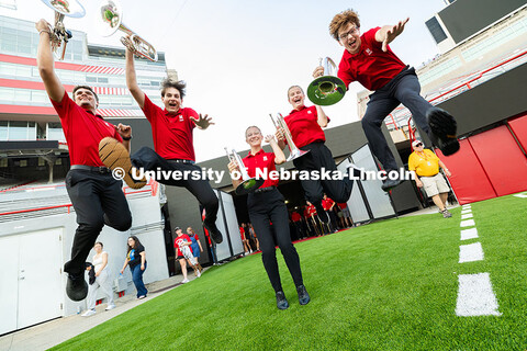 Mellophone players Parker McIlnay, Brennan Clark, Lily Gliske, Faith Rinaldi and Hudson Carrico jump