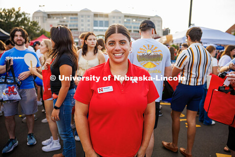 Kalan Walters poses for a portrait in the middle of a crowd during the Big Red Welcome Street Festiv