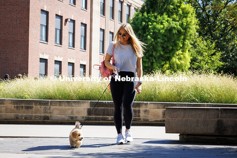Senior Advertising and Public Relations major, Sydney Allmand, walks her 5-month-old puppy, Maisie, 