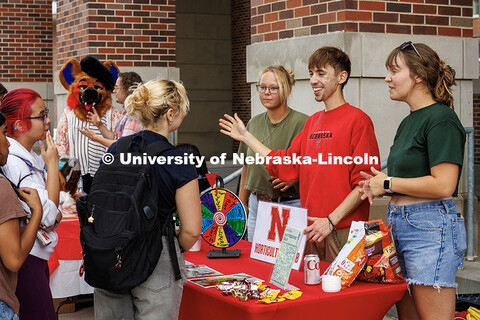 The Horticulture club hands out plants as a prize during the NVolvement Fair on City Campus. Student