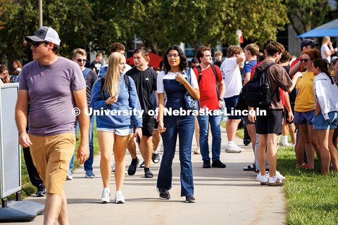 Freshman, Ella Cox (left) and Marilyn Lopez, walk through the Union Plaza during the Nvolvement Fair