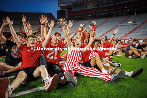 A group of students cheer during the Nebraska vs. Cincinnati football game watch party in Memorial S