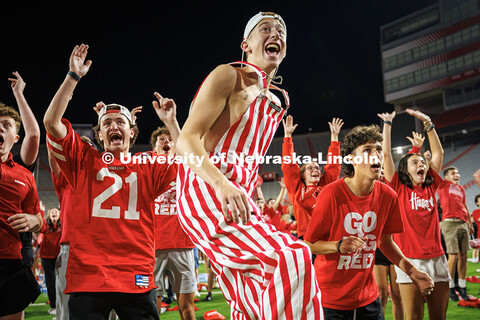 Students celebrate a touchdown at the Nebraska vs. Cincinnati football game watch party in Memorial 