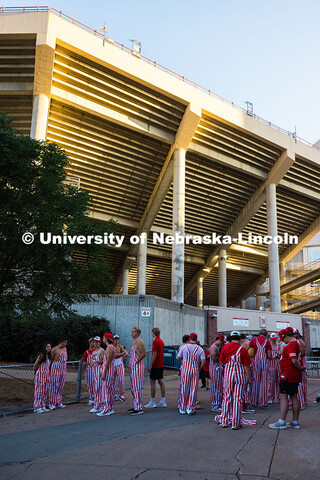 Husker students wear bibs outside of Memorial Stadium before the football game against Houston Chris