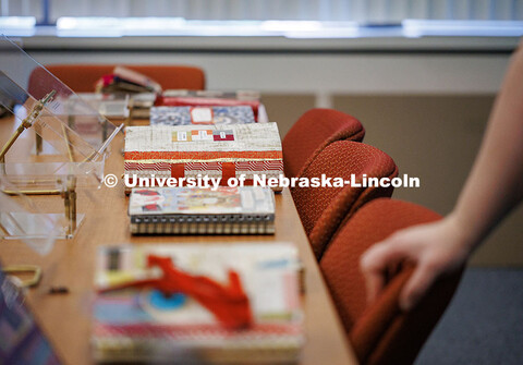 A group of Karen Blessen’s journals laid out to be displayed at an exhibit hosted by UNL Libraries