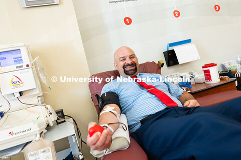 Tony Lazarowicz, director of academic advising for the College of Arts and Sciences, donates blood a