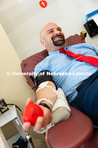 Tony Lazarowicz, director of academic advising for the College of Arts and Sciences, donates blood a
