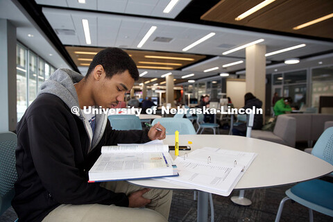 Marco Pinto, a junior biological sciences major, reads in UNL's new Adele Coryell Learning Commons o
