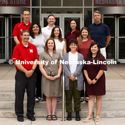 Group portrait of the Academic Navigators outside of the Nebraska Union. First row, l-r: Eric Einspa