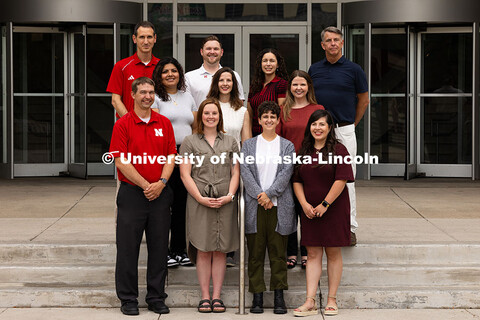 Group portrait of the Academic Navigators outside of the Nebraska Union. First row, l-r: Eric Einspa